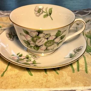 Puritan cup and saucer. White flowers with pink and gray tops gold trim